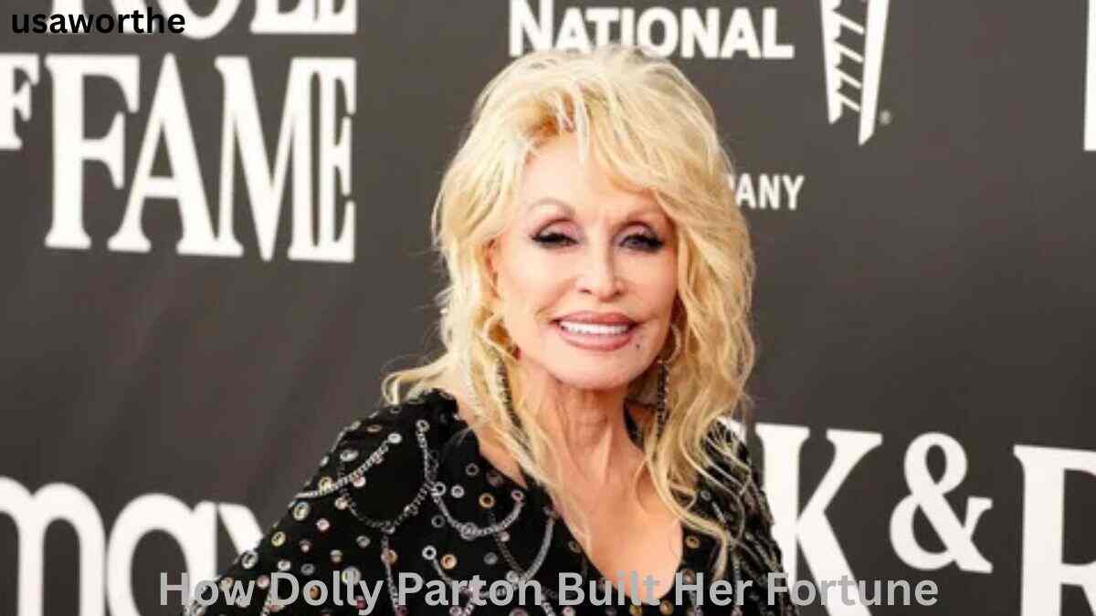 Dolly Parton smiling at a red carpet event, highlighting how Dolly Parton built her fortune through music, business, and investments.