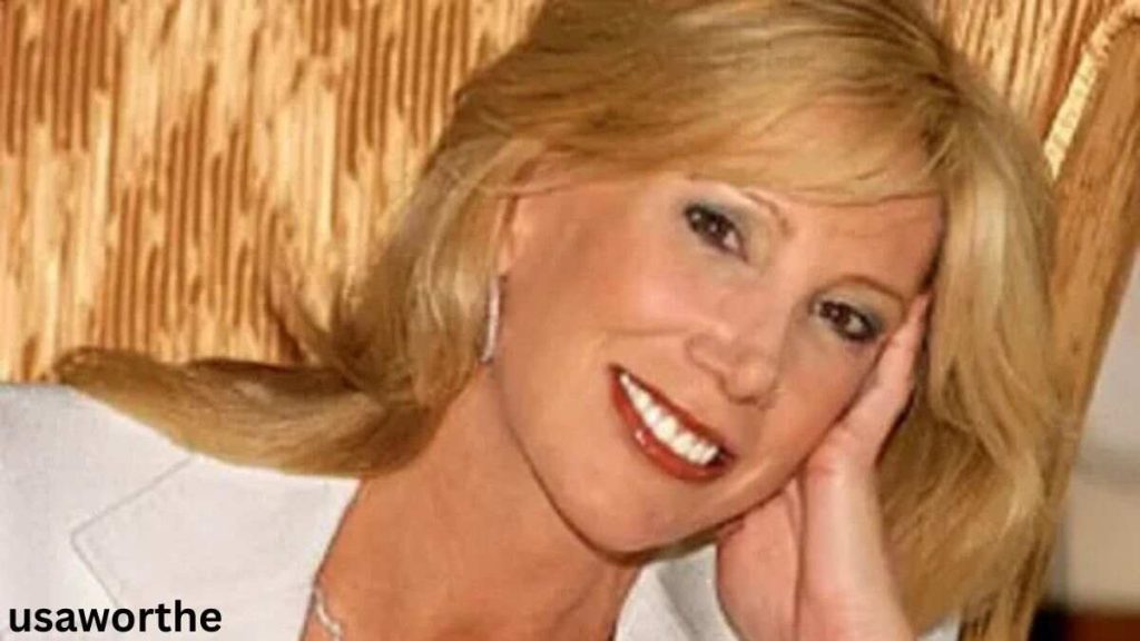 Janet Elway smiling in a close-up portrait, highlighting her elegant appearance and public image associated with Janet Elway.