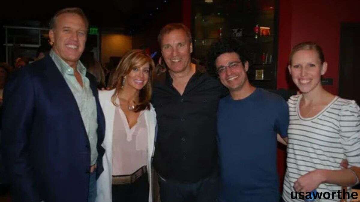 Janet Elway posing with family and friends at a social event, smiling together in a group photo featuring Janet Elway.