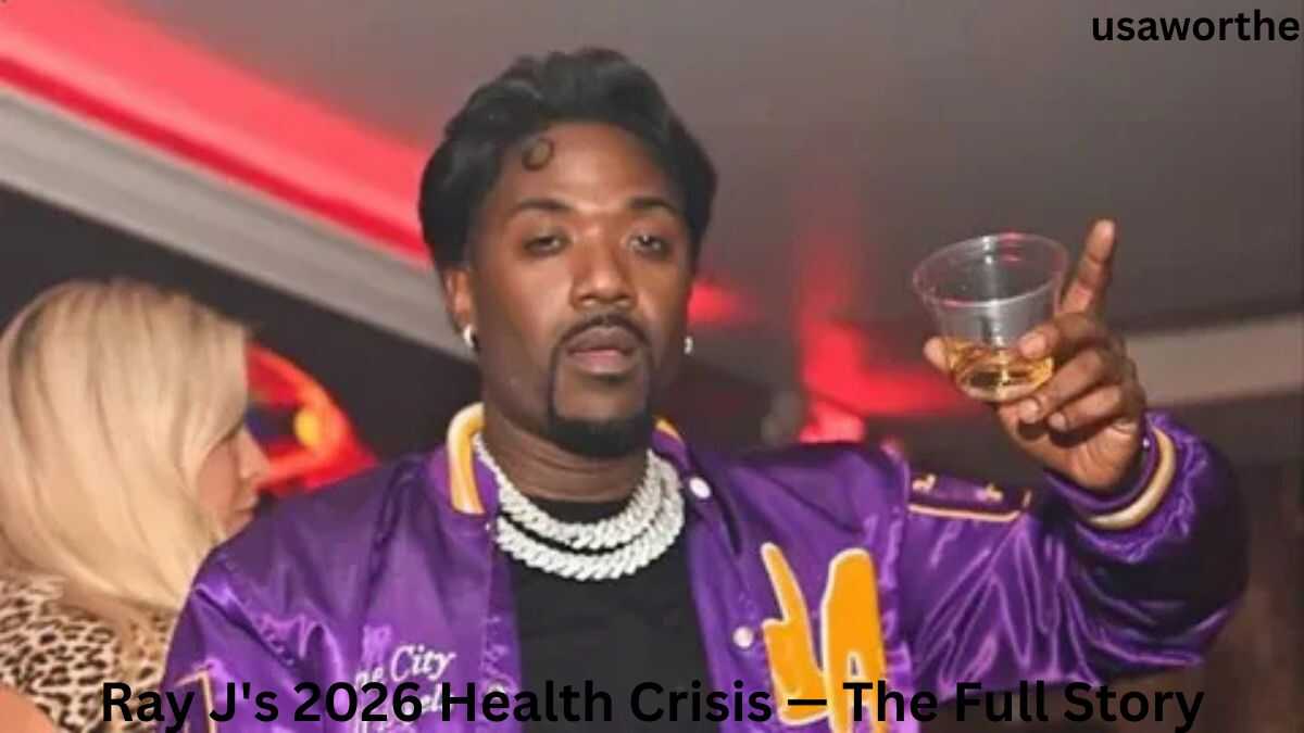 Ray J at a public event wearing a purple jacket, featured in coverage of Ray J's 2026 Health Crisis and recent life updates.