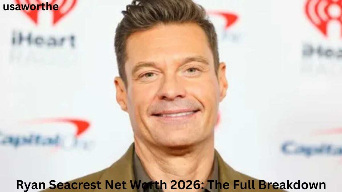Ryan Seacrest posing at a media event, highlighting the success story behind Ryan Seacrest Net Worth 2026.