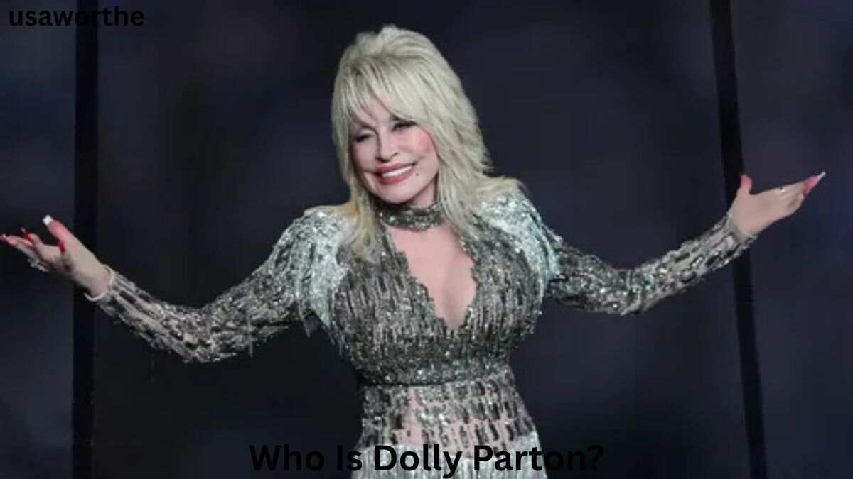 Dolly Parton smiling in a sparkling silver outfit during a public appearance, highlighting the legendary entertainer behind the question, Who Is Dolly Parton?