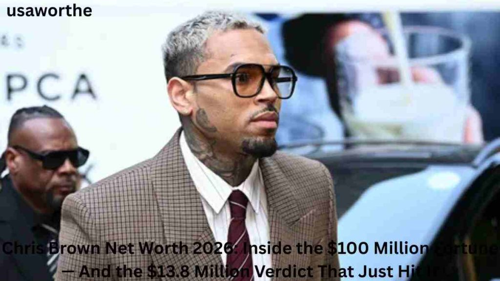 Chris Brown Net Worth 2026 – Chris Brown arriving at a public event in a suit, highlighting his estimated $100 million fortune, music career, business ventures, and recent legal challenges.