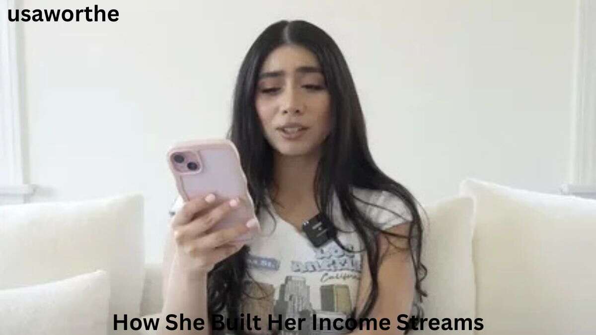 Violet Myers holding a smartphone while recording content, highlighting the multiple income streams that contributed to Violet Myers Net Worth 2026.